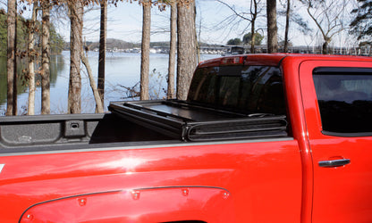 Lund 04-15 Nissan Titan (5.5ft. Bed) Hard Fold Tonneau Cover w/Bracket Kit - Black