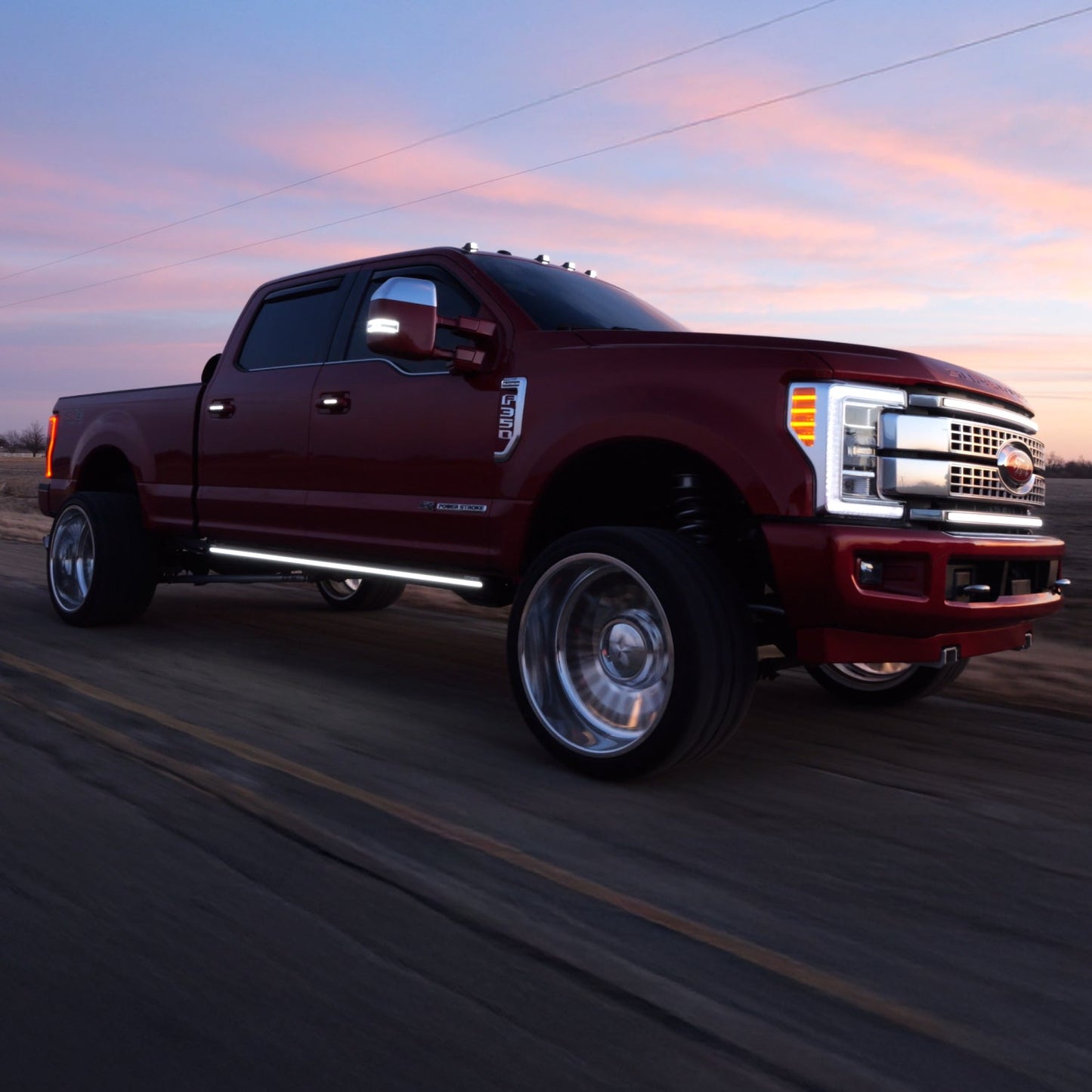 Red 17-22 F350 with Boost Auto M2 running boards, mirror lights and cab lights all lit up in white