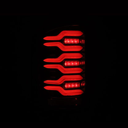 AlphaRex 14-18 GMC Sierra 1500/2500HD/3500HD LUXX-Series LED Tail Lights Alpha-Blk Actv Lgt Seq. Sig