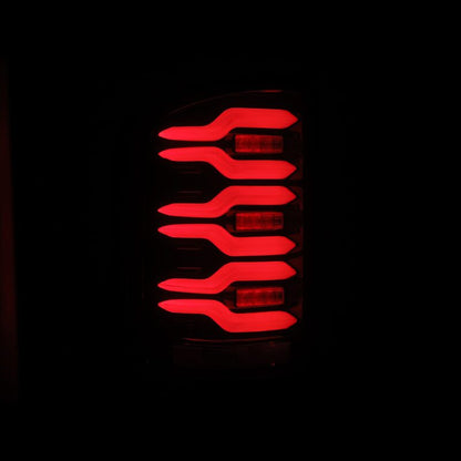 AlphaRex 14-18 GMC Sierra 1500/2500HD/3500HD LUXX-Series LED Tail Lights Blk/Red w/Actv Lgt Seq. Sig