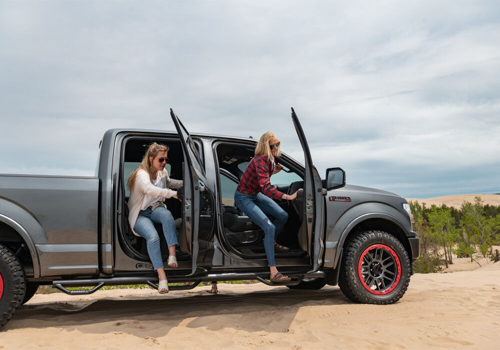 Nerf Step Bar Wheel-to-Wheel with Bed Access (3 Steps per Side) 3 Inch Main Tube Diameter 2015-2025 Ford F-150 5 Foot 7 Inch SuperCrew Textured Black NFab